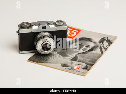 Vintage 35mm camera and magazine Stock Photo