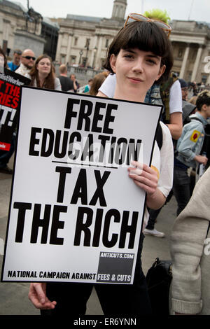 A protester holds a placard saying 