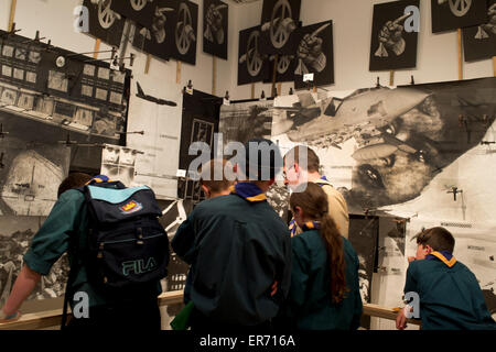 Lambeth. Imperial War Museum. Young scouts visit 'Boardroom' part of Peter Kennard's Unofficial War Artist Exhibit. Stock Photo
