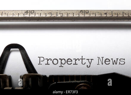 Property news printed on an old typewriter Stock Photo