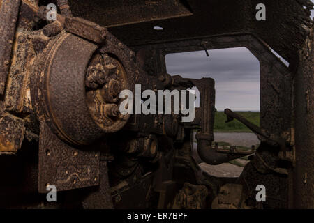 Lounges sur mer, Normandy, France. An old, rusting German gun at dusk. Stock Photo