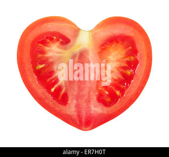 Red tomato in a cut is photographed close-up on a white background Stock Photo