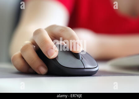 Close-up of business woman hand with mouse. Shallow depth of field. Selective focus. Stock Photo