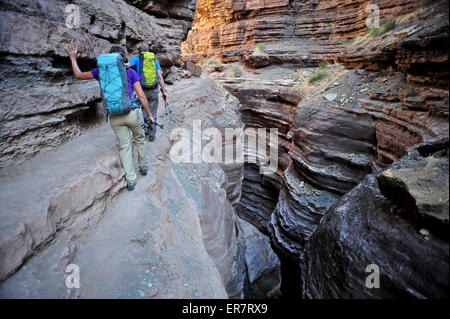 Hikers walk along Deer Creek Narrows in the Grand Canyon outside of Fredonia, Arizona November 2011. Stock Photo