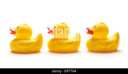 Three yellow duck toys on white background Stock Photo