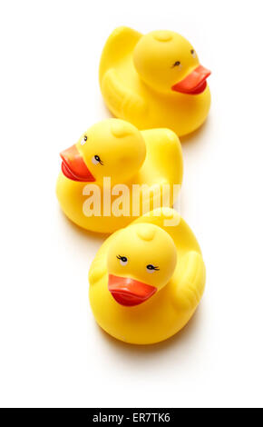 Three yellow duck toys on white background Stock Photo