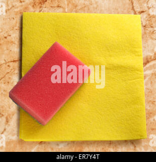Yellow duster and red sponge in closeup Stock Photo