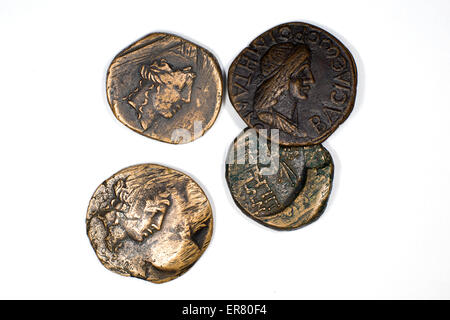 Old bronze coins with portrait of king on a white background Stock Photo