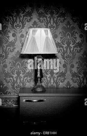 Retro lamp on blue rococo background. Vintage pattern. Vintage lamp. Vignette. Rich rustic interior Stock Photo