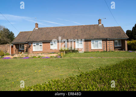 Semi-detached bungalow housing in village of Sutton, Suffolk, England, UK Stock Photo