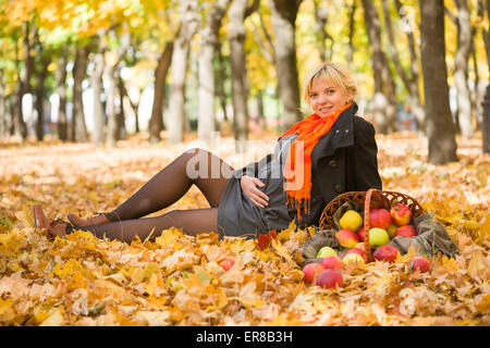 pregnant woman in autumn park Stock Photo