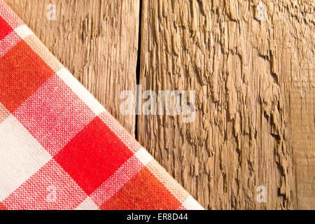 Checkered napkin on rustic wooden background (table, texture) Stock Photo