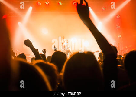 Male singer performing in front of audience Stock Photo