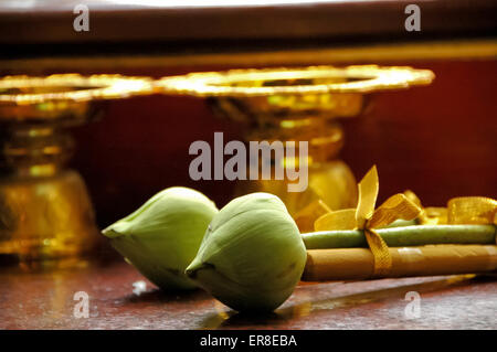 Double lotus and candle offering in Thai temple Stock Photo