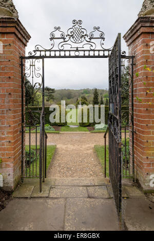 View across Ranmore Common and Surrey Hills through a gate at Polesdon Lacey, Great Bookham, near Dorking, Surrey, England, UK. Stock Photo