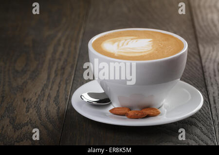 cup of freshly made cappuccino with latte art Stock Photo