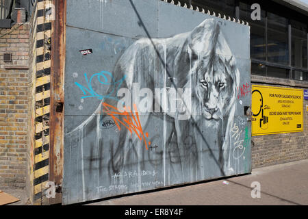 'Hunger – the marauders – the Strong and the Weak' by street artist Faith47. Old Truman Brewery, Hanbury Street, London UK. Stock Photo