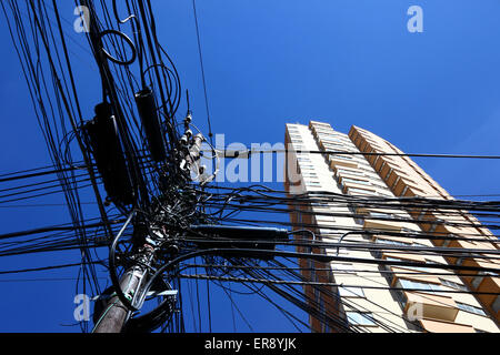 Tangled mass of electrical cables on post, La Paz, Bolivia Stock Photo