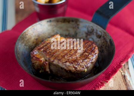 Cooked Steak in a frying pan Stock Photo