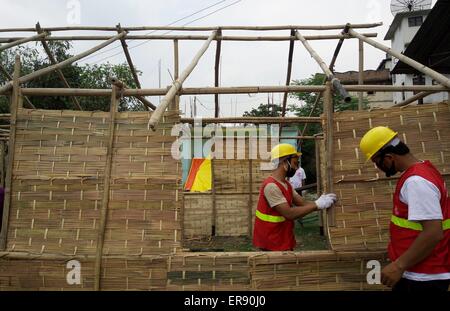 Kathmandu, Nepal. 29th May, 2015. Volunteers work to build temporary classrooms outside a damaged school in Kathmandu, capital of Nepal, on May 29, 2015. Schools in quake-affected districts are making further preparations to resume classes scheduled on May 31. Credit:  Sunil Sharma/Xinhua/Alamy Live News Stock Photo
