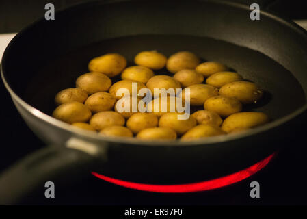 Boiling potatoes Stock Photo