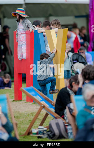 Hay on Wye, UK Wednesday 27 May 2015  Pictured: Children play on the Hay letters on the festival green at the Hay Festival  Re: The 2015 Hay Festival takes place in Hay on Wye, Powys, Wales Stock Photo