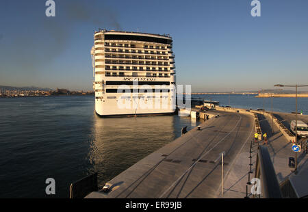 MSC Cruises Cruise ship “MSC FANTASIA” (333.3 mtrs ) - arriving at early evening in Port - past Palma famous Gothic Cathedral Stock Photo