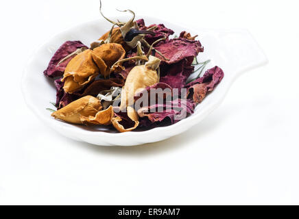 Dried rose buds and petals on white background Stock Photo