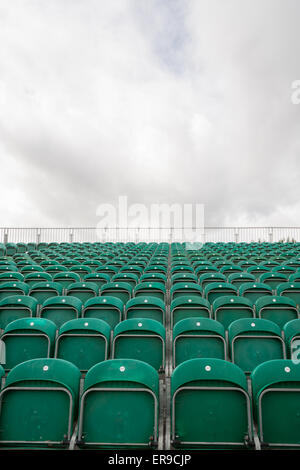 Empty green stadium seats Stock Photo