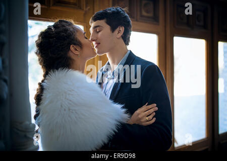 Portrait of happy wedding couple in classic interior Stock Photo