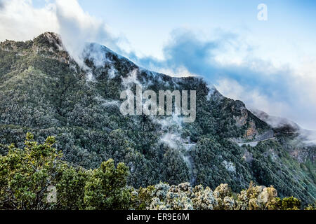 Mountain and clouds over peak with road in Tenerife Canary island, Spain Stock Photo