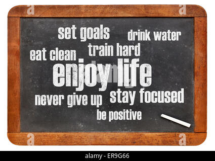 enjoy life - healthy lifestyle word cloud on a vintage blackboard Stock Photo