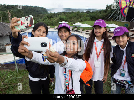 Puerto Iguazu, Argentina. 29th May, 2015. Members of a Peruvian choir take selfies during a general rehearsal, during the 6th edition of the Child-Youth Festival 'Iguazu in Concert', in the city of Puerto Iguazu, Argentina, on May 29, 2015. According to local press, over 800 youngsters will play pieces of the classical and folk repertoire of their countries, in a meeting of orchestras, choirs and a select group of soloists that perfect a festival immersed in the Misiones rainforest and the Iguazu Falls. © Martin Zabala/Xinhua/Alamy Live News Stock Photo