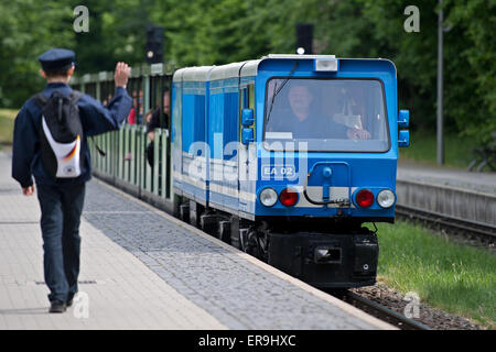 Dresden, Germany. 21st May, 2015. The EA02 engine of the Dresden Park Railway (Dresdner Parkeisenbahn) with train driver Hans-Joachim Gutte, arrives at the station in the Grosser Garten in Dresden, Germany, 21 May 2015. The park railway celebrates its 65th birthday on 1 June. Photo: Arno Burgi/dpa/Alamy Live News Stock Photo