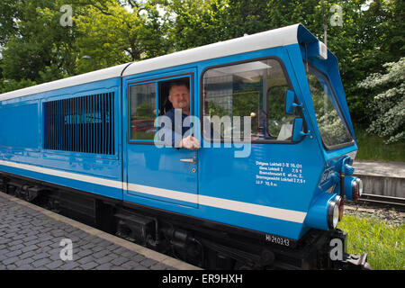 Dresden, Germany. 21st May, 2015. The EA02 engine of the Dresden Park Railway (Dresdner Parkeisenbahn) with train driver Hans-Joachim Gutte, arrives at the station in the Grosser Garten in Dresden, Germany, 21 May 2015. The park railway celebrates its 65th birthday on 1 June. Photo: Arno Burgi/dpa/Alamy Live News Stock Photo