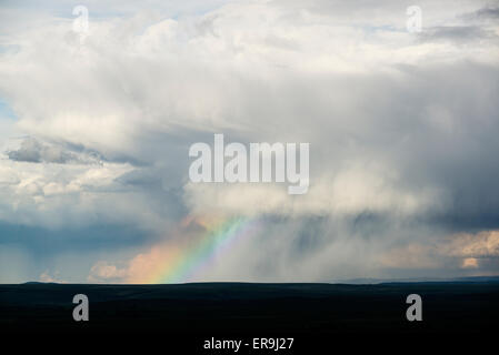 Storm cloud and rainbow over Oregon's Wallowa Valley. Stock Photo