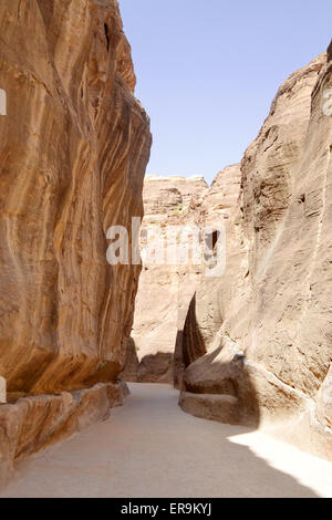 Tunnel between the rocky mountains in the ancient city of Petra, Jordan. Stock Photo