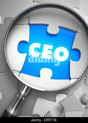 CEO - Chief Executive Officer - Puzzle with Missing Piece through Loupe. 3d Illustration with Selective Focus. Stock Photo