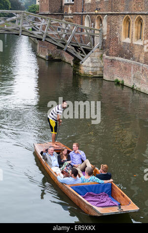 UK, England, Cambridge.  Punting on the River Cam by the Mathematical Bridge, Queen's College.