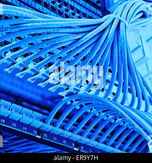 kind of wiring closet patch panels with 6-th category in the background Stock Photo