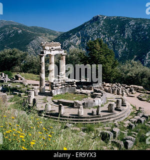 The Tholos below Mount Parnassus, Delphi, Phocis, Central Greece, Greece, Europe Stock Photo