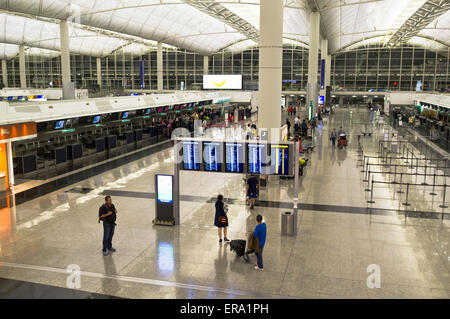 dh Hong Kong airport CHEK LAP KOK HONG KONG Check in desk departure board hk checkin departures terminal Stock Photo