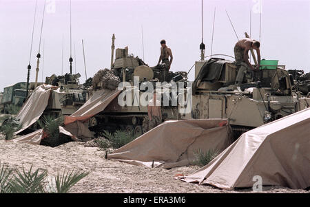 5th March 1991 Soldiers relax in the sunshine on their FV432 APCs at the British Army's HQ in Kuwait.