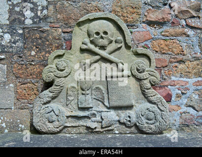 Skull and crossbones on memorial, in churchyard, UK Stock Photo