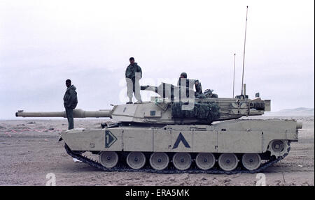 23rd March 1991 U.S. Army soldiers with their M1A1 Abrams tank in the desert in northern Kuwait.