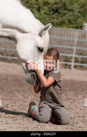 girl and pony Stock Photo