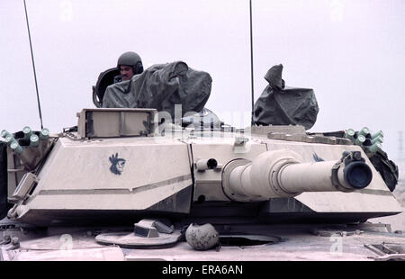 23rd March 1991 A U.S. Army soldier on his M1A1 Abrams tank, parked in the desert in northern Kuwait.