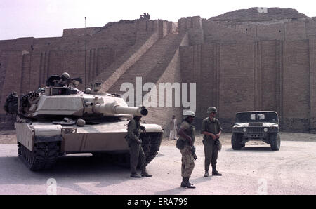 2nd April 1991 U.S. Army soldiers stand next to an M1A1 Abrams tank in front of the Great Ziggurat of Ur in southern Iraq.