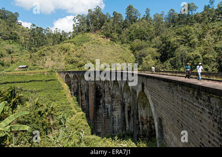 People Wlak on Nine Arches Bridge near Ella, Hill Country of Sri Lanka Stock Photo