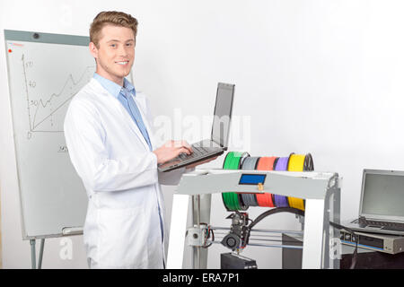 Scientist working with three-dimensional  printer Stock Photo